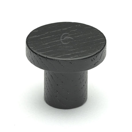 This is an image of a M.Marcus - Wooden Cabinet Knob Round Circum Design 33mm Black Ash Finish, w4470-33-ash that is available to order from Trade Door Handles in Kendal.