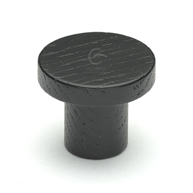 This is an image of a M.Marcus - Wooden Cabinet Knob Round Circum Design 33mm Black Ash Finish, w4470-33-ash that is available to order from Trade Door Handles in Kendal.