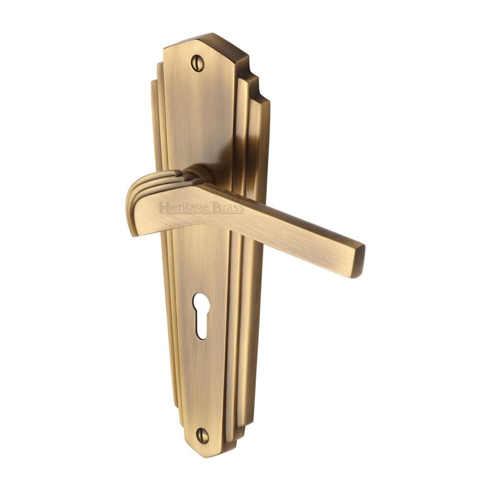 This is an image of a Heritage Brass - Door Handle Lever Lock Waldorf Design Antique Brass Finish, wal6500-at that is available to order from Trade Door Handles in Kendal.