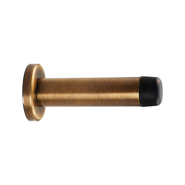 This is an image of a Carlisle Brass - Cylinder Pattern Door Stop - with Rose - Antique Brass that is availble to order from Trade Door Handles in Kendal.