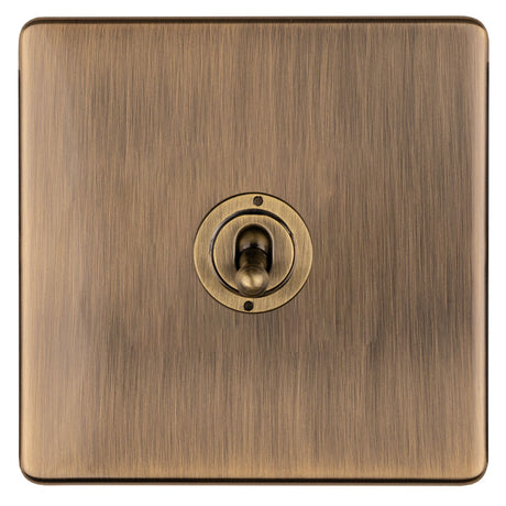 This is an image showing Eurolite 1 Gang 10Amp 2Way Toggle Switch- Antique Brassabt1sw available to order from trade door handles, quick delivery and discounted prices.