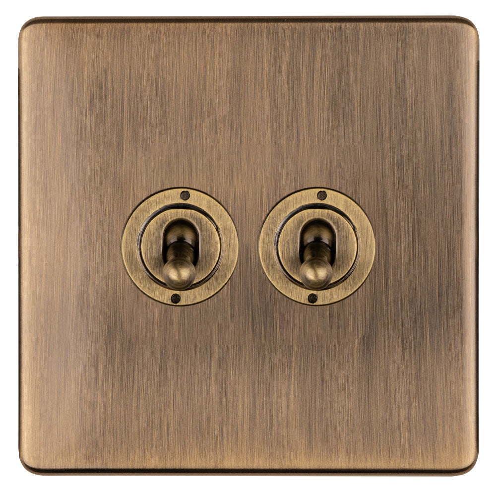 This is an image showing Eurolite 2 Gang 10Amp 2Way Toggle Switch - Antique Brassabt2sw available to order from trade door handles, quick delivery and discounted prices.