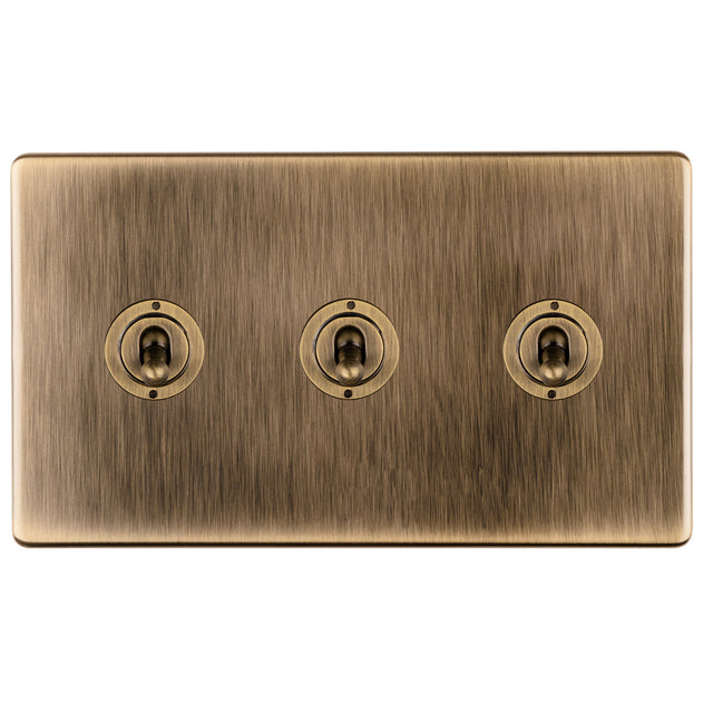 This is an image showing Eurolite 3 Gang 10Amp 2Way Toggle Switch- Antique Brassabt3sw available to order from trade door handles, quick delivery and discounted prices.