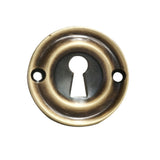 This is an image of a Carlisle Brass - Small Escutcheon - Florentine Bronze that is availble to order from Trade Door Handles in Kendal.