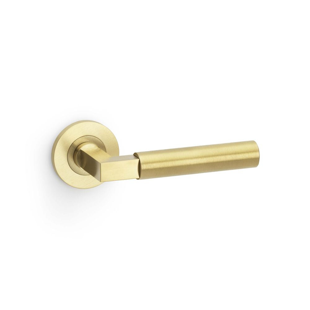 This is an image showing Alexander & Wilks Hurricane Plain Lever on Round Rose - Satin Brass PVD aw201sbpvd available to order from Trade Door Handles in Kendal, quick delivery and discounted prices.