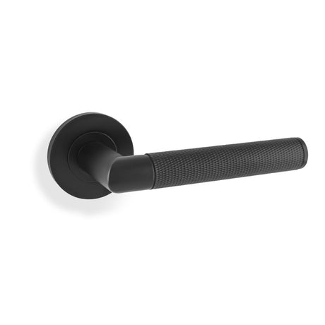 This is an image showing Alexander & Wilks Harrier Knurled Lever on Round Rose - Black aw210bl available to order from trade door handles, quick delivery and discounted prices.