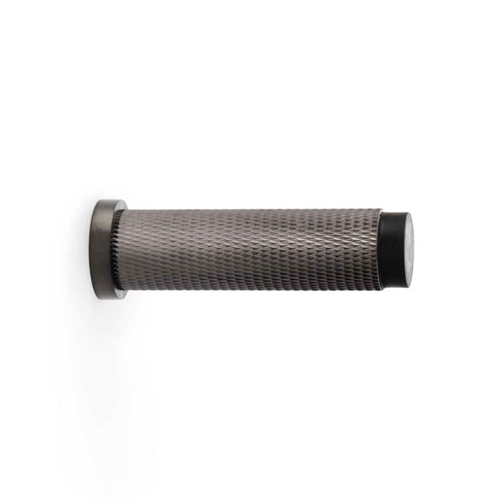 This is an image showing Alexander & Wilks Brunel Knurled Door Stop - Dark Bronze PVD aw600-75-dbzpvd available to order from Trade Door Handles in Kendal, quick delivery and discounted prices.