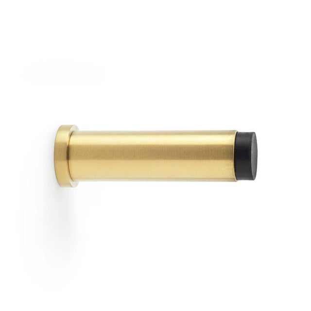 This is an image showing Alexander & Wilks Plain Projection Cylinder Door Stop - Satin Brass PVD aw601-75-sbpvd available to order from Trade Door Handles in Kendal, quick delivery and discounted prices.