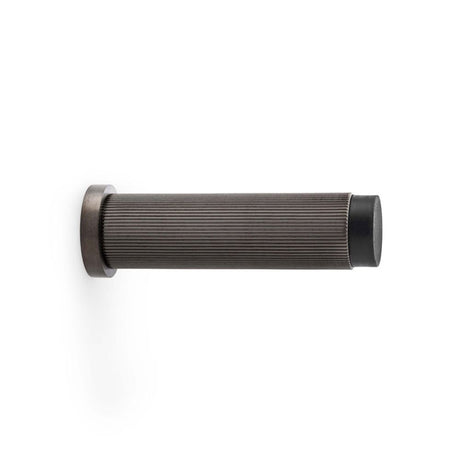 This is an image showing Alexander & Wilks Reeded Projection Door Stop - Dark Bronze PVD aw602-75-dbzpvd available to order from Trade Door Handles in Kendal, quick delivery and discounted prices.