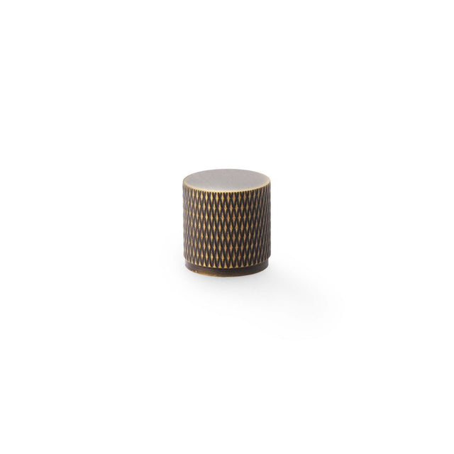 This is an image showing Alexander & Wilks Brunel Knurled Cylinder Cupboard Knob - Antique Brass - 20mm aw800-20-ab available to order from Trade Door Handles in Kendal, quick delivery and discounted prices.