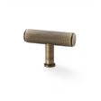 This is an image showing Alexander & Wilks Crispin Knurled T-bar Cupboard Knob - Antique Brass aw801-55-ab available to order from Trade Door Handles in Kendal, quick delivery and discounted prices.