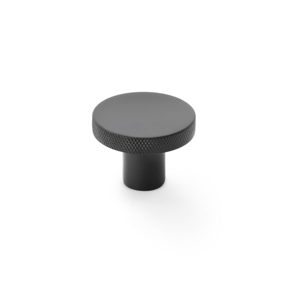 This is an image showing Alexander & Wilks Hanover Knurled Circular Cupboard Knob - Black - 38mm aw802-38-bl available to order from Trade Door Handles in Kendal, quick delivery and discounted prices.