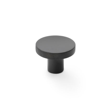 This is an image showing Alexander & Wilks Hanover Knurled Circular Cupboard Knob - Black - 38mm aw802-38-bl available to order from Trade Door Handles in Kendal, quick delivery and discounted prices.