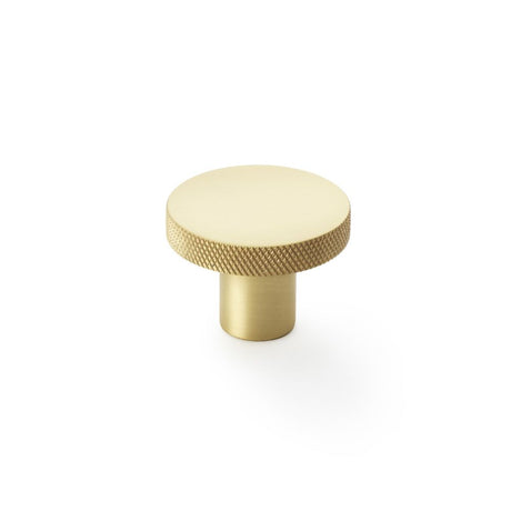 This is an image showing Alexander & Wilks Hanover Knurled Circular Cupboard Knob - Satin Brass - 38mm aw802-38-sb available to order from Trade Door Handles in Kendal, quick delivery and discounted prices.