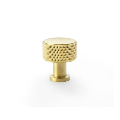 This is an image showing Alexander & Wilks Lucia Knurled Cupboard Knob - Satin Brass PVD - 29mm aw807k-29-sbpvd available to order from Trade Door Handles in Kendal, quick delivery and discounted prices.