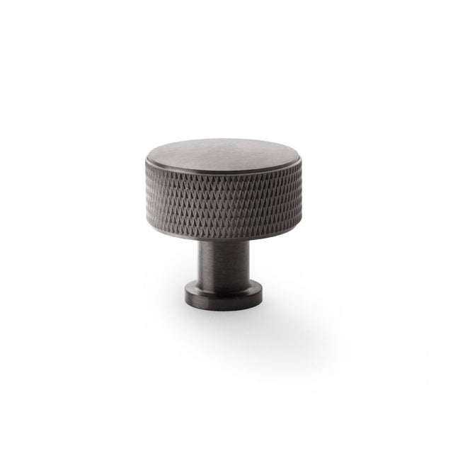 This is an image showing Alexander & Wilks Lucia Knurled Cupboard Knob - Dark Bronze PVD - 35mm aw807k-35-dbzpvd available to order from Trade Door Handles in Kendal, quick delivery and discounted prices.