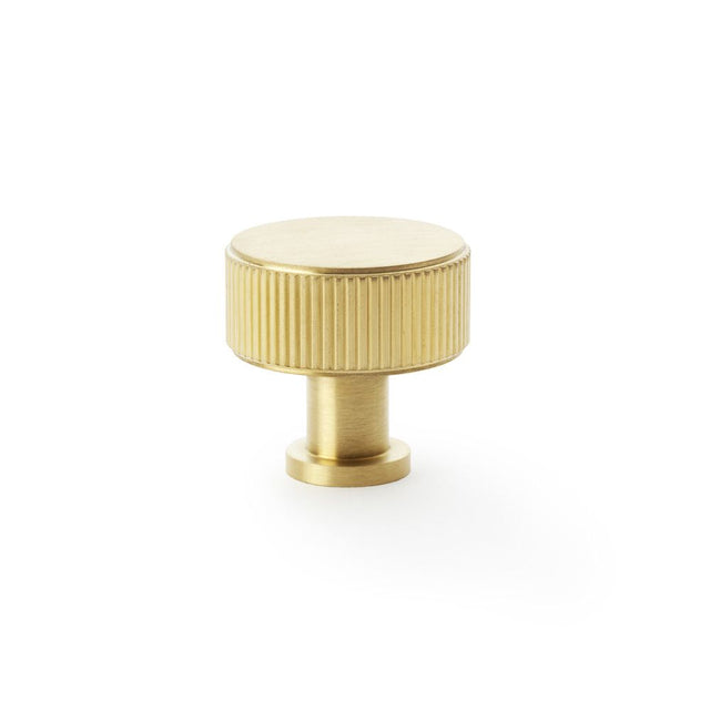 This is an image showing Alexander & Wilks Lucia Reeded Cupboard Knob - Satin Brass PVD - 35mm aw807r-35-sbpvd available to order from Trade Door Handles in Kendal, quick delivery and discounted prices.