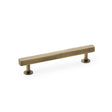 This is an image showing Alexander & Wilks Square T-Bar Cabinet Pull Handle - Antique Brass - Centres 128mm aw815-128-ab available to order from Trade Door Handles in Kendal, quick delivery and discounted prices.