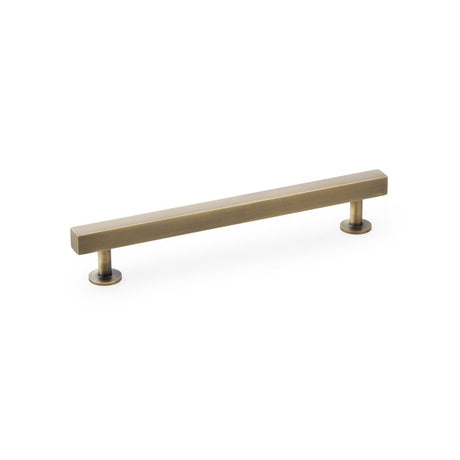 This is an image showing Alexander & Wilks Square T-Bar Cabinet Pull Handle - Antique Brass - Centres 160mm aw815-160-ab available to order from Trade Door Handles in Kendal, quick delivery and discounted prices.