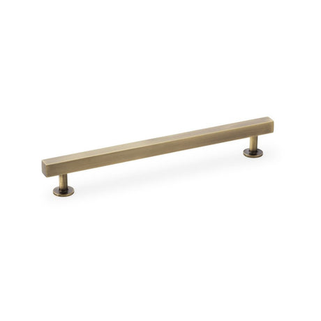 This is an image showing Alexander & Wilks Square T-Bar Cabinet Pull Handle - Antique Brass - Centres 192mm aw815-192-ab available to order from Trade Door Handles in Kendal, quick delivery and discounted prices.