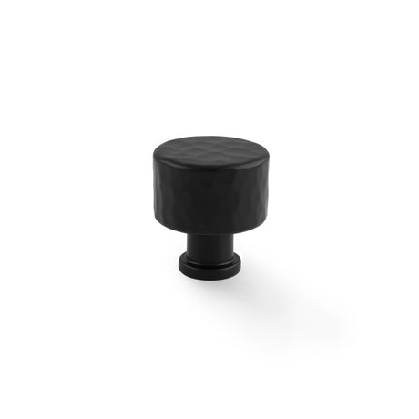 This is an image showing Alexander & Wilks Leila - Hammered Cupboard Knob - Black - 30mm aw816-30-bl available to order from trade door handles, quick delivery and discounted prices.