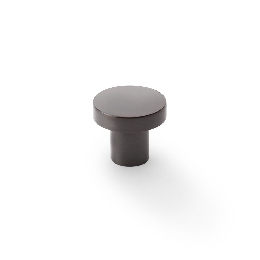 This is an image showing Alexander & Wilks Hanover Plain Cupboard Knob - Dark Bronze - Knob 30mm aw821-30-dbz available to order from Trade Door Handles in Kendal, quick delivery and discounted prices.