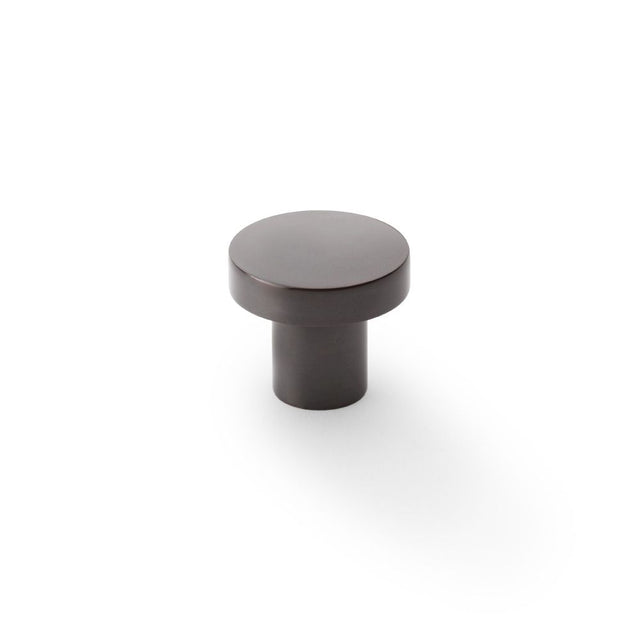 This is an image showing Alexander & Wilks Hanover Plain Cupboard Knob - Dark Bronze - Knob 30mm aw821-30-dbz available to order from Trade Door Handles in Kendal, quick delivery and discounted prices.