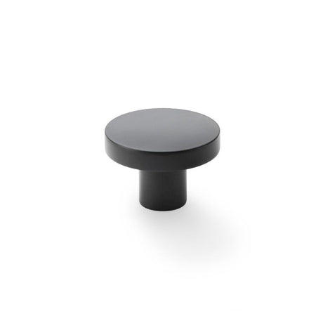 This is an image showing Alexander & Wilks Hanover Plain Cupboard Knob - Black - Knob 38mm aw821-38-bl available to order from Trade Door Handles in Kendal, quick delivery and discounted prices.