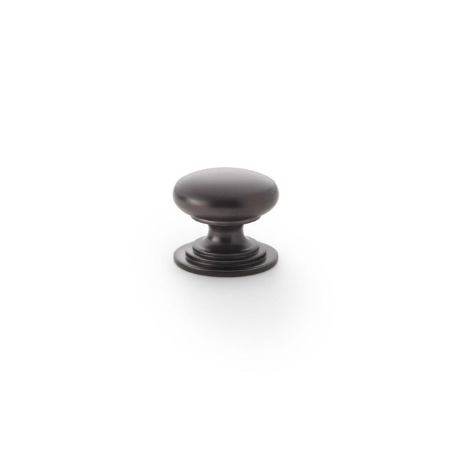 This is an image showing Alexander & Wilks Waltz Round Cupboard Knob on Stepped Rose - Dark Bronze - 25mm aw825-25-dbz available to order from Trade Door Handles in Kendal, quick delivery and discounted prices.