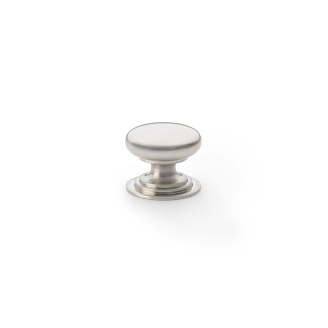 This is an image showing Alexander & Wilks Waltz Round Cupboard Knob on Stepped Rose - Satin Nickel - 25mm aw825-25-sn available to order from Trade Door Handles in Kendal, quick delivery and discounted prices.