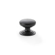This is an image showing Alexander & Wilks Waltz Round Cupboard Knob on Stepped Rose - Black - 32mm aw825-32-bl available to order from Trade Door Handles in Kendal, quick delivery and discounted prices.