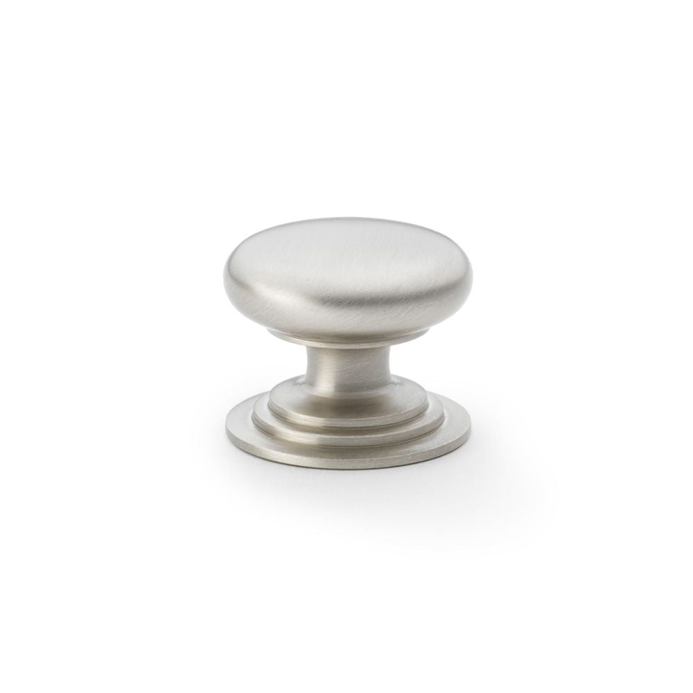 This is an image showing Alexander & Wilks Waltz Round Cupboard Knob on Stepped Rose - Satin Nickel - 38mm aw825-38-sn available to order from Trade Door Handles in Kendal, quick delivery and discounted prices.