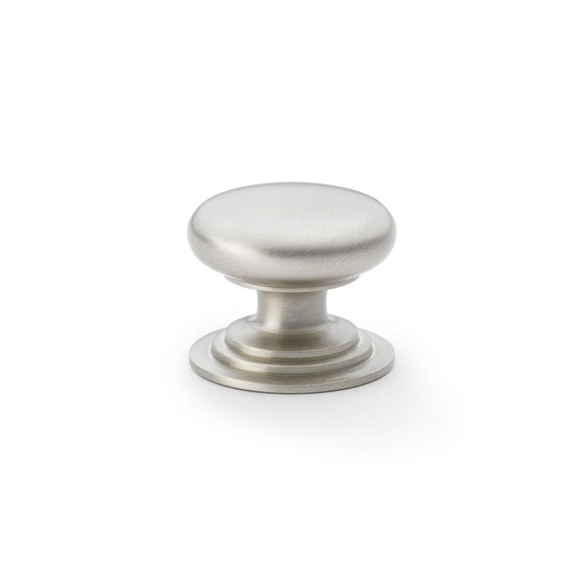 This is an image showing Alexander & Wilks Waltz Round Cupboard Knob on Stepped Rose - Satin Nickel - 38mm aw825-38-sn available to order from Trade Door Handles in Kendal, quick delivery and discounted prices.