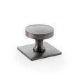 This is an image showing Alexander & Wilks Bullion Cupboard Knob on Square Backplate - Dark Bronze PVD aw835-38-dbzpvd available to order from Trade Door Handles in Kendal, quick delivery and discounted prices.