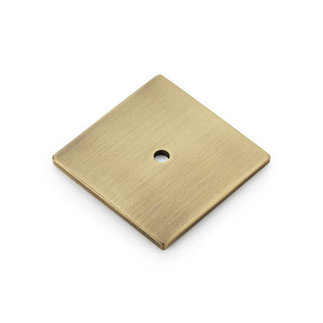 This is an image showing Alexander & Wilks Bullion Square Backplate - Antique Brass aw894-45-ab available to order from Trade Door Handles in Kendal, quick delivery and discounted prices.