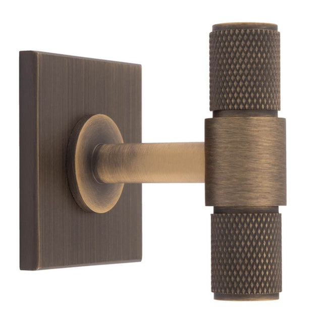 This is an image of a Carlisle Brass - Knurled T-Bar on backplate that is availble to order from Trade Door Handles in Kendal.