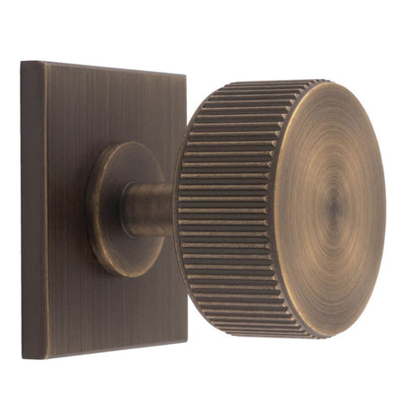 This is an image of a Carlisle Brass - Lines Radio Knob on Backplate that is availble to order from Trade Door Handles in Kendal.