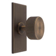 This is an image of a Carlisle Brass - Lines Radio Knob on Backplate that is availble to order from Trade Door Handles in Kendal.