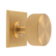 This is an image of a Carlisle Brass - Lines Radio Knob on Backplate that is availble to order from Trade Door Handles in Kendal.