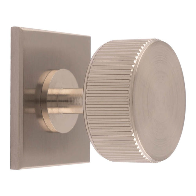 This is an image of a Carlisle Brass - Lines Radio Knob on Backplate that is availble to order from Trade Door Handles in Kendal.