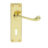 This is an image of a Carlisle Brass - Contract Victorian Scroll Lever on Lock Backplate - Polished Br that is availble to order from Trade Door Handles in Kendal.