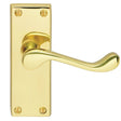 This is an image of a Carlisle Brass - Contract Victorian Scroll Lever on Latch Backplate - Polished B that is availble to order from Trade Door Handles in Kendal.