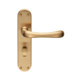 This is an image of a Manital - Ibra Lever on WC Backplate - Satin Brass that is availble to order from Trade Door Handles in Kendal.