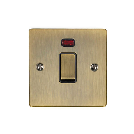 This is an image showing Eurolite Enhance Decorative 20Amp Switch with Neon Indicator - Antique Brass (With Black Trim) en20aswnabb available to order from trade door handles, quick delivery and discounted prices.