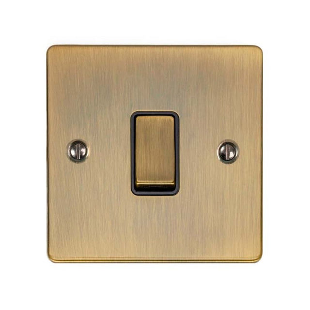 This is an image showing Eurolite Enhance Decorative Intermediate Switch - Antique Brass (With Black Trim) enintabb available to order from trade door handles, quick delivery and discounted prices.