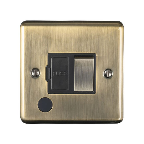 This is an image showing Eurolite Enhance Decorative Switched Fuse Spur With Flex Outlet - Antique Brass (With Black Trim) enswffoabb available to order from trade door handles, quick delivery and discounted prices.