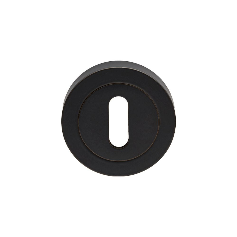 This is an image of a Carlisle Brass - Lock Escutcheon - Matt Black that is availble to order from Trade Door Handles in Kendal.