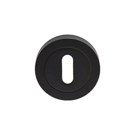 This is an image of a Carlisle Brass - Lock Escutcheon - Matt Black that is availble to order from Trade Door Handles in Kendal.