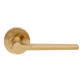 This is an image of a Carlisle Brass - Velino Lever on Round Rose - Satin Brass that is availble to order from Trade Door Handles in Kendal.