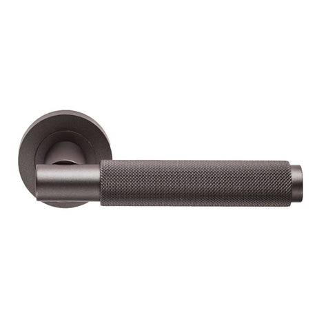 This is an image of a Carlisle Brass - Varese Knurled Lever on Rose - Matt Bronze that is availble to order from Trade Door Handles in Kendal.